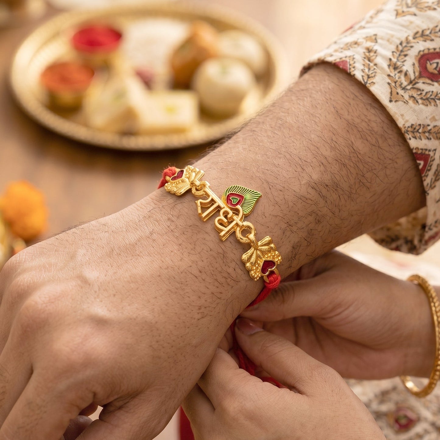 Close-up of Golden Radhe Peacock Feather Rakhi highlighting detailed craftsmanship