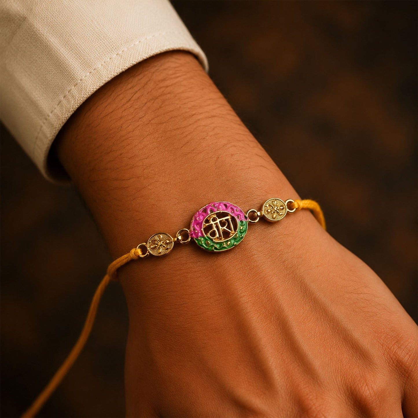 Elegant meenakari designed rakhi in pink and green for brothers