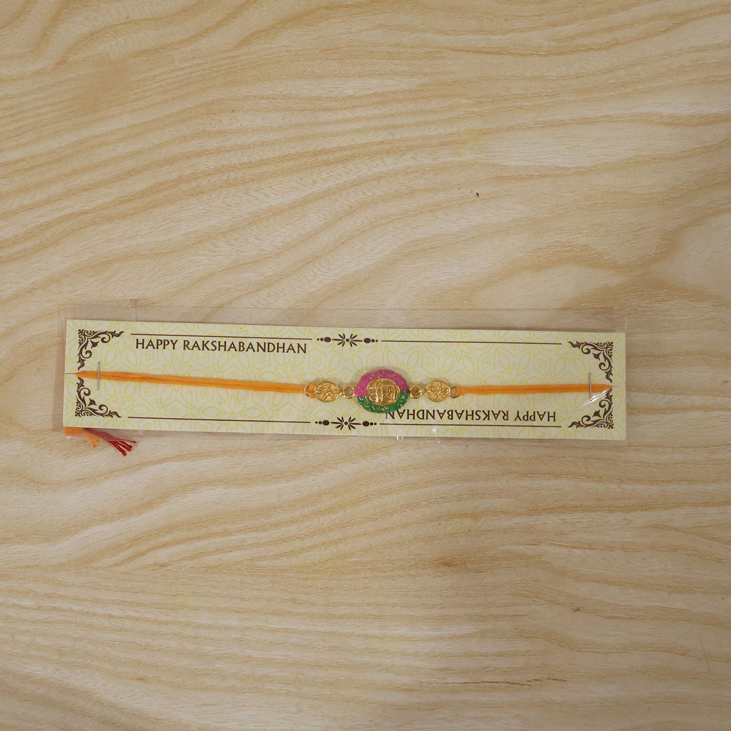 Designer Pink Green Meenakari Rakhi with traditional festive appeal