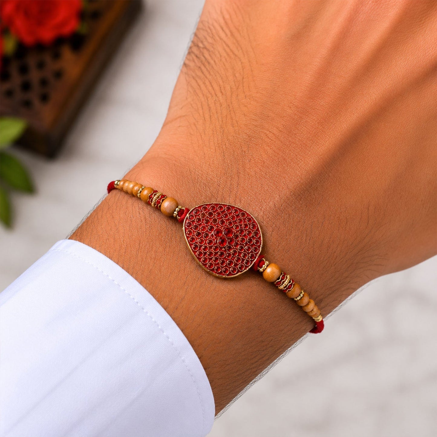 Close-up of decorative beads and intricate detailing on the Rakhi.