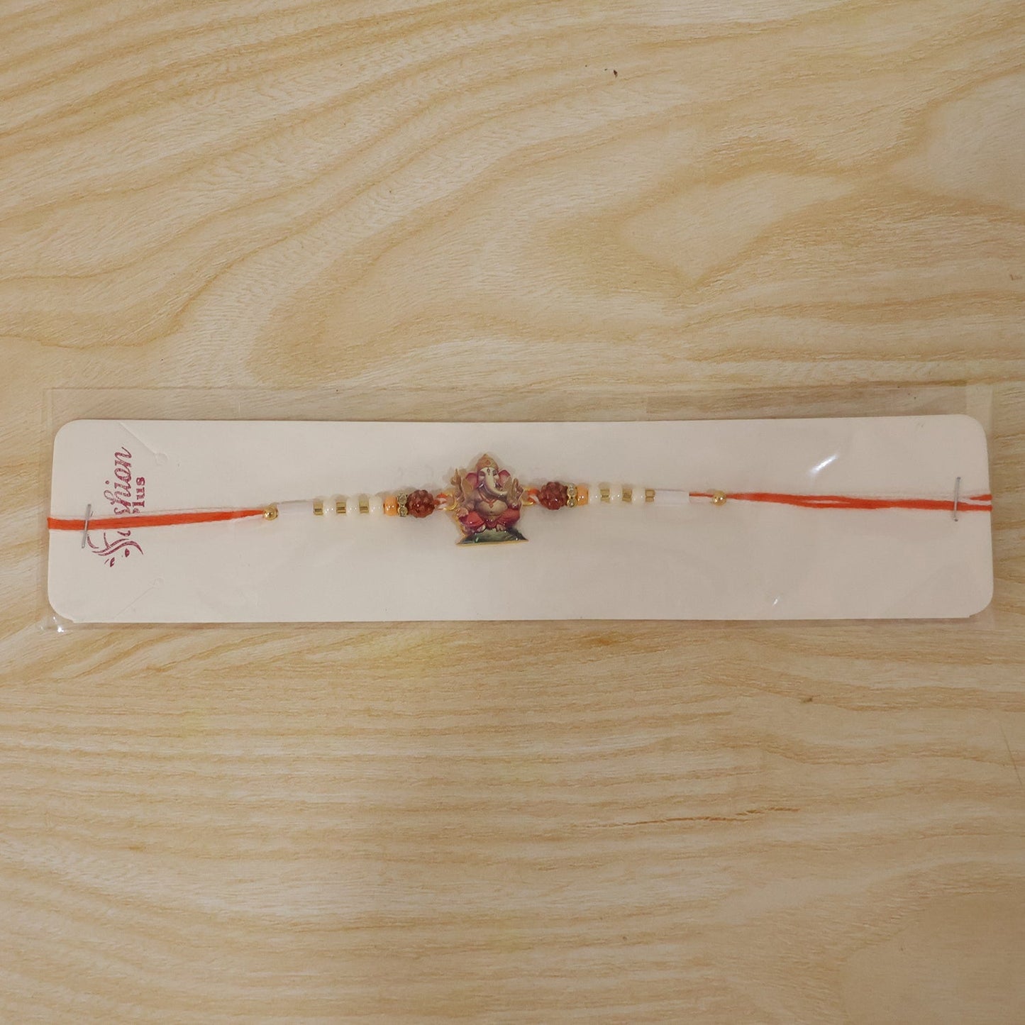 Premium decorative Rakhi with Lord Ganesha and Rudraksha beads for festival celebration