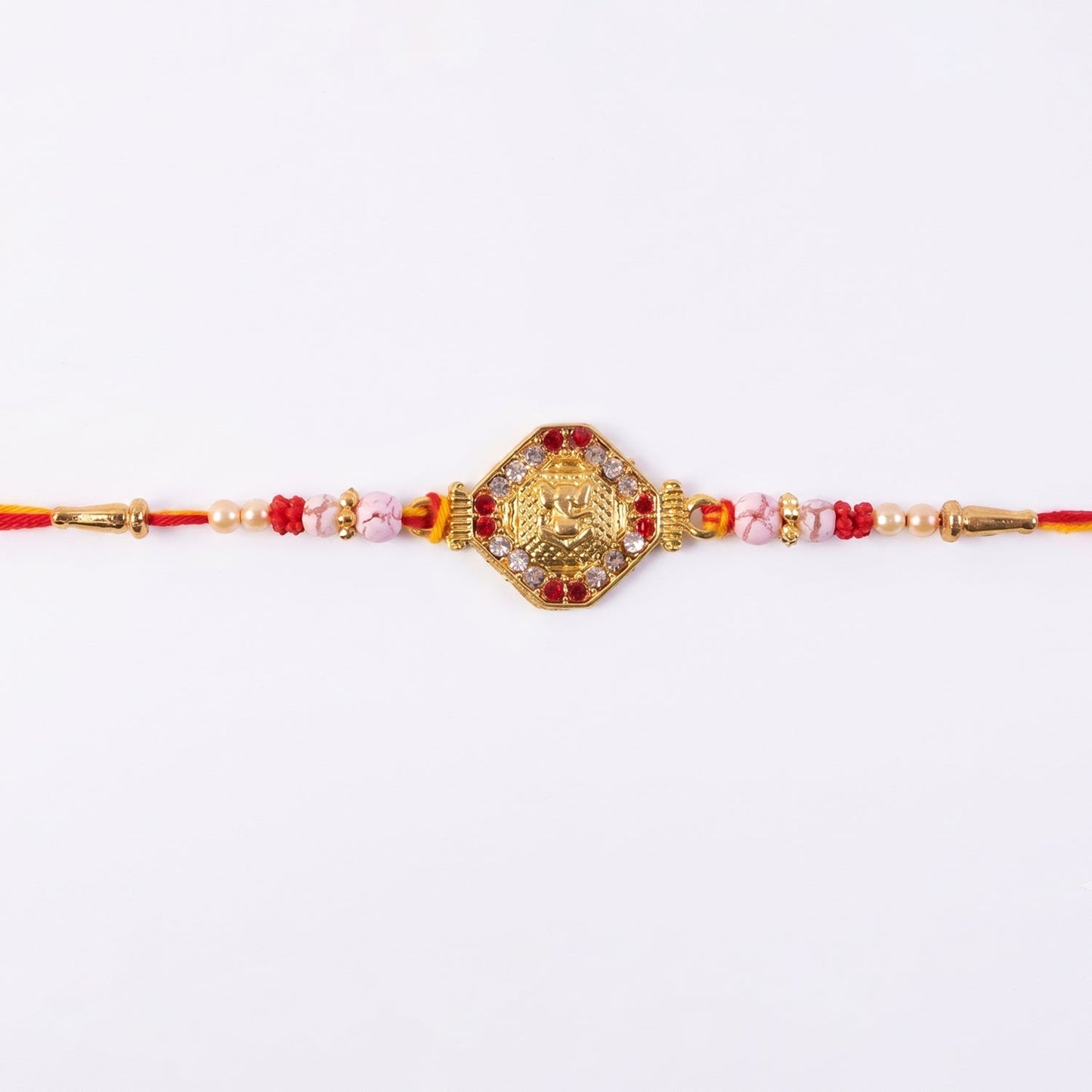 Elegant Rakhi featuring red and white stones for Raksha Bandhan