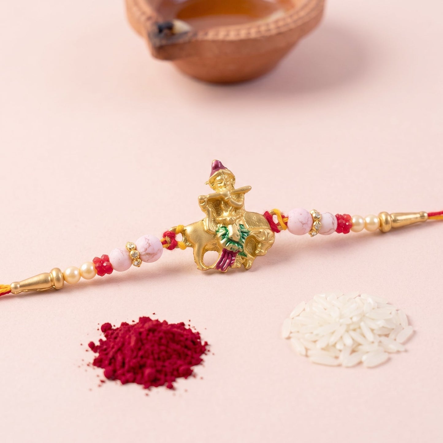 Stylish Bal Gopal Krishna cow flute rakhi with attractive centerpiece