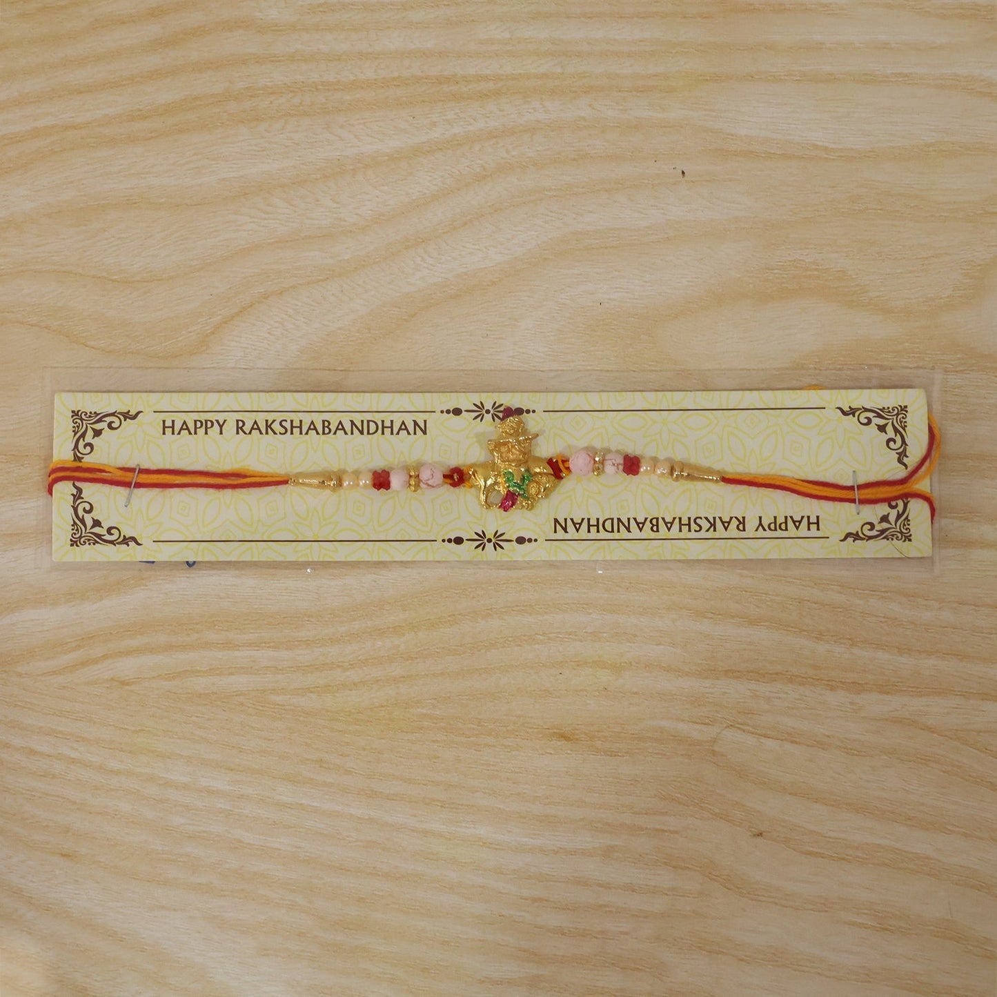Decorative Bal Gopal Krishna cow flute rakhi suitable for brothers of all ages