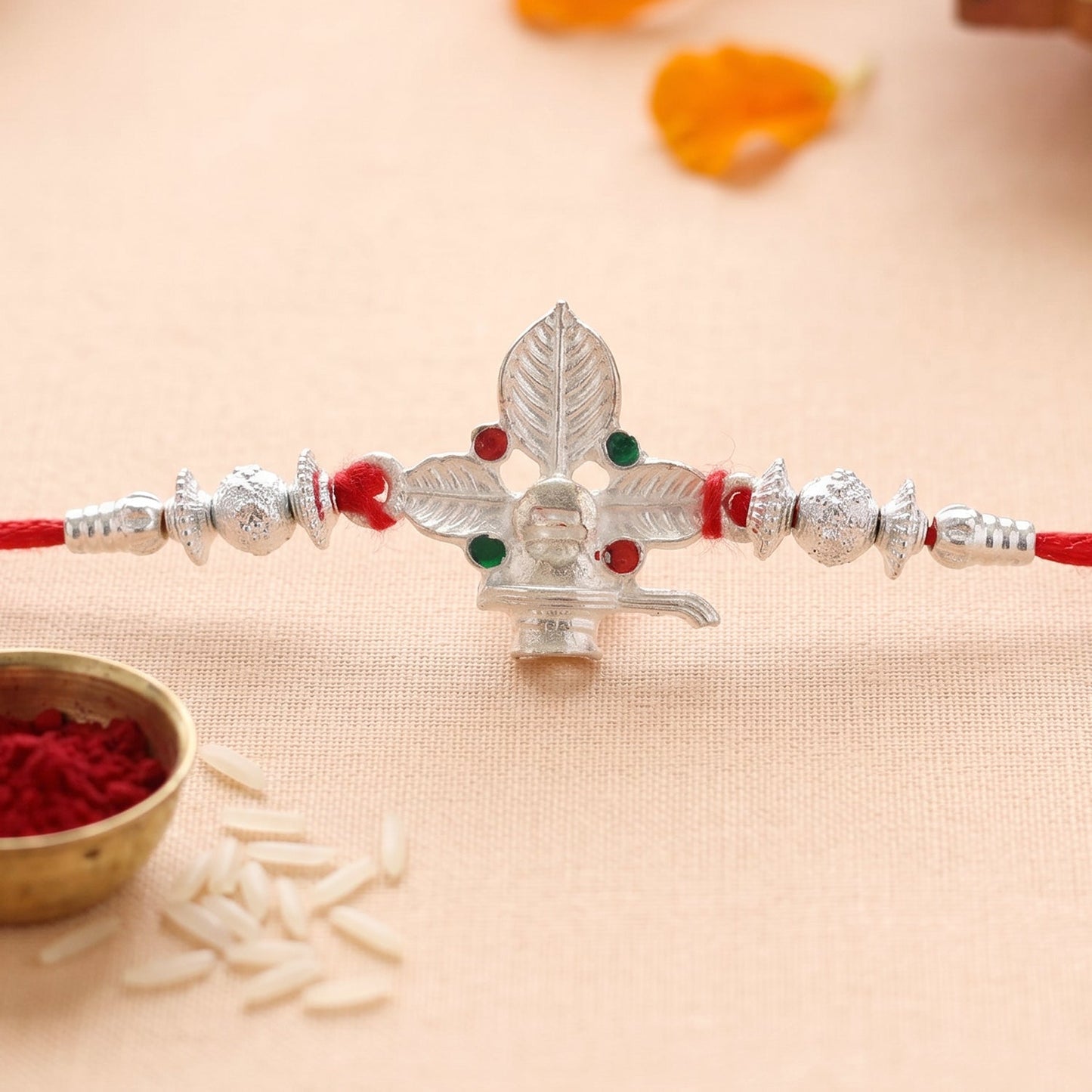 Silver Shiv Bilva Leaf Rakhi with decorative beads and detailed finish