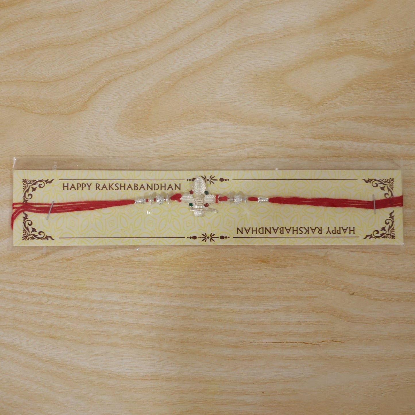 Stylish Shiv Bilva Leaf Rakhi showcasing decorative beads and craftsmanship