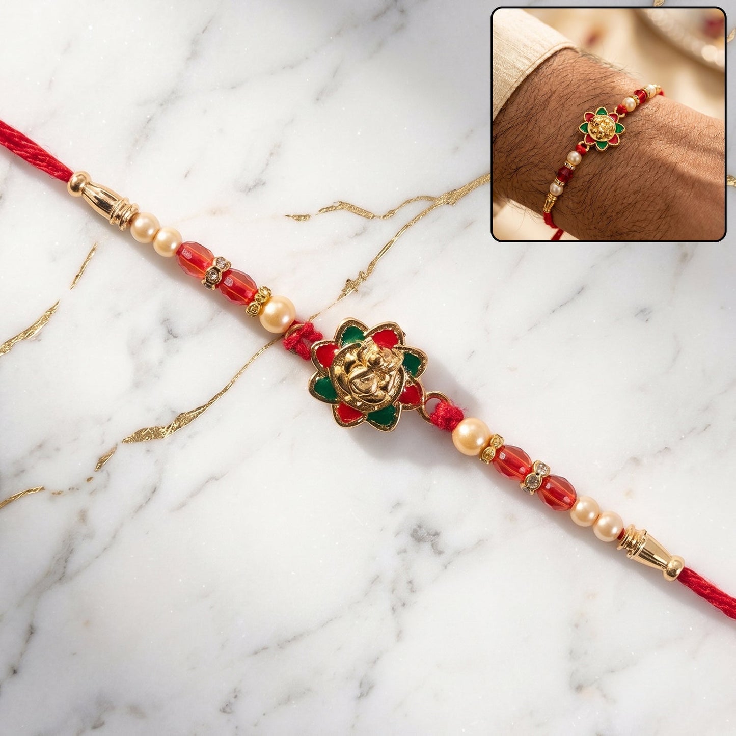 Close-up of traditional golden floral meenakari rakhi with pearls and red beads