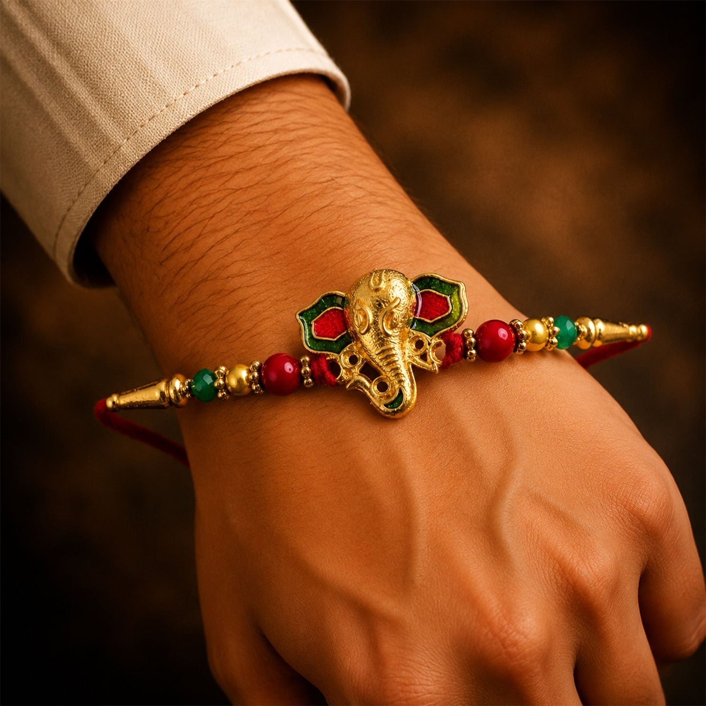 Colorful Lord Ganesha Rakhi with traditional design and beads