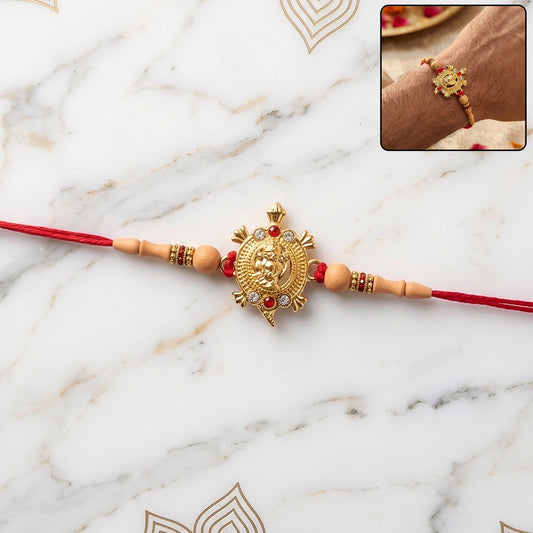 Elegant Golden Om Rakhi with beads for brother, perfect for Rakshabandhan celebration.