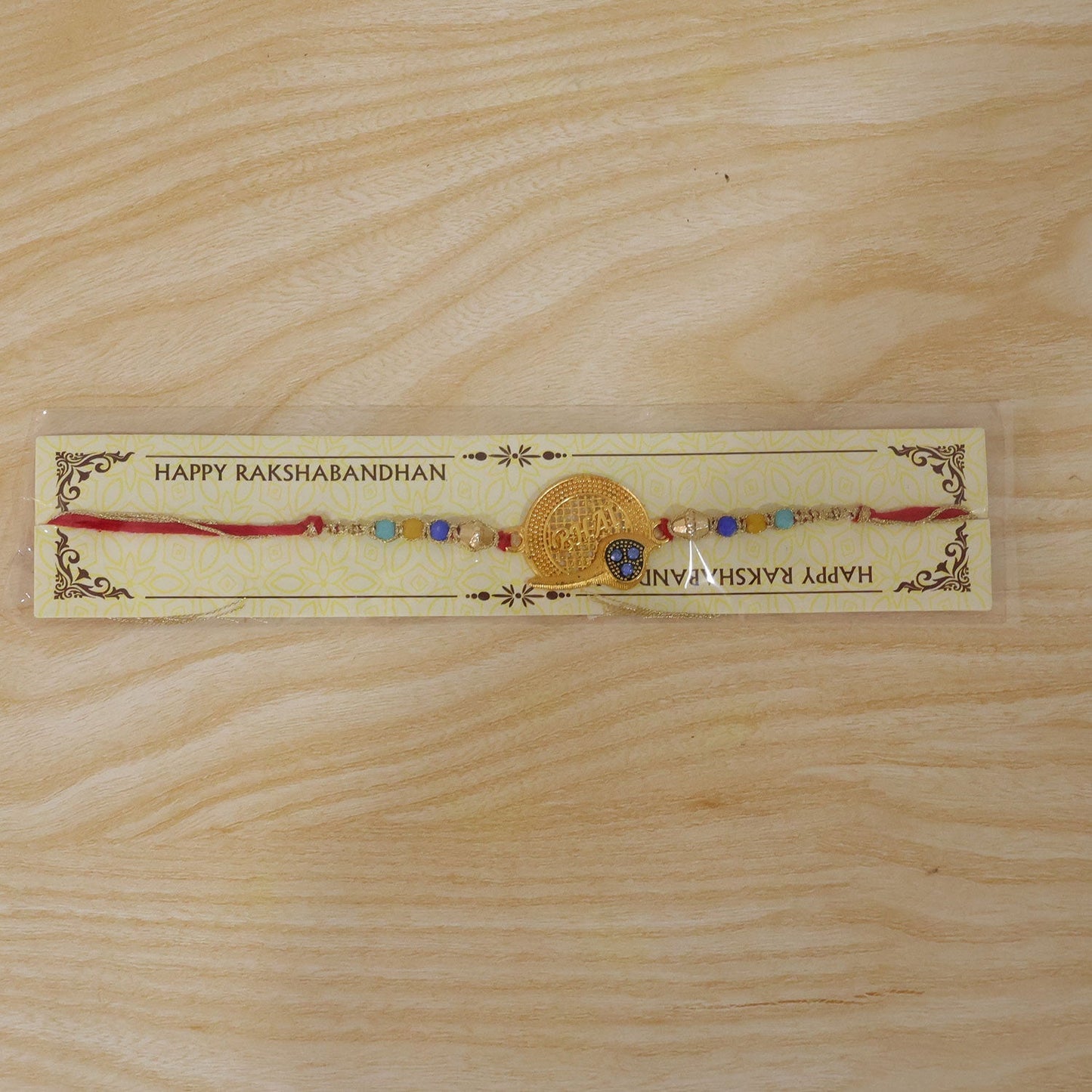 Close-up of the thread and bead work on the Rakhi, suitable for gifting.