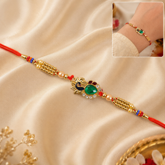 Beautiful floral design with a golden lotus motif and green stones for Rakshabandhan