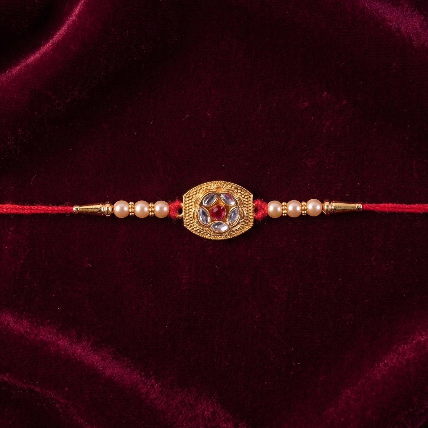 Close-up of intricate floral AD stone design on the Designer Rakhi.