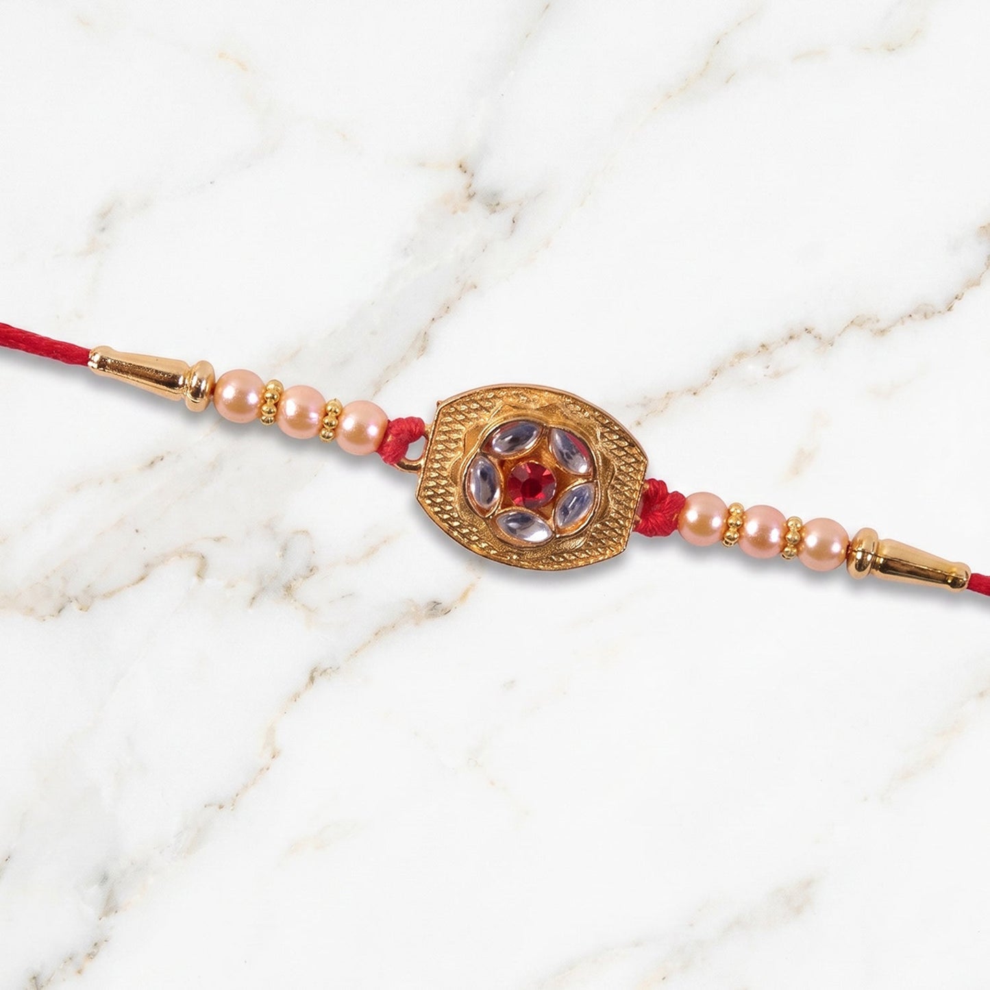 Rear view of comfortable thread and gold plated Rakhi design.