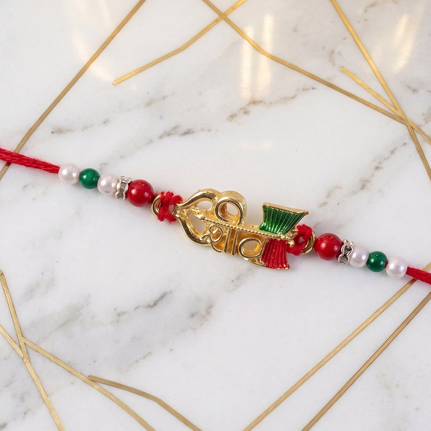 Close-up of the finely crafted Meenakari Rakhi highlighting craftsmanship.