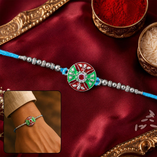 Meenakari floral Rakhi with silver beads on blue thread for brother