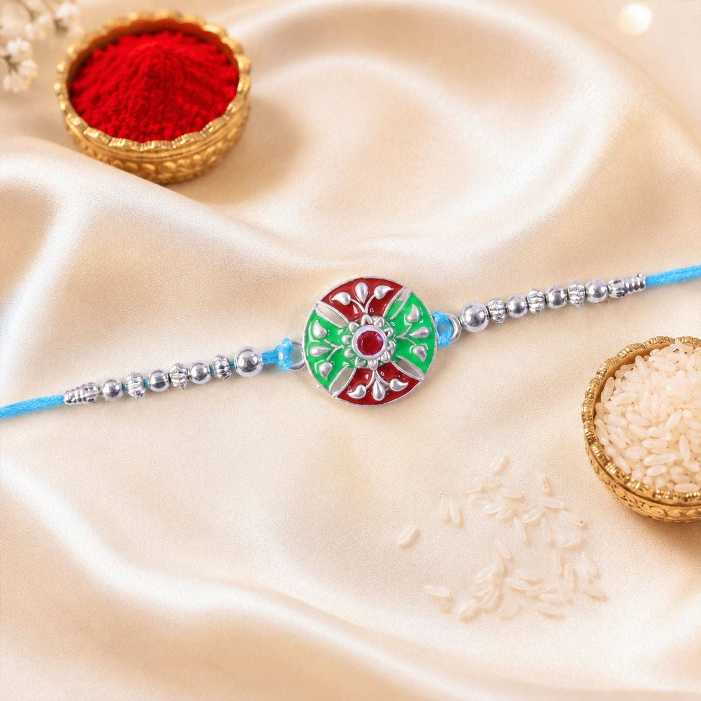 Rakhi displayed for Raksha Bandhan with silver beads and floral design