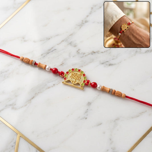 Traditional Meenakari Rakhi with golden sandalwood beads, front view.