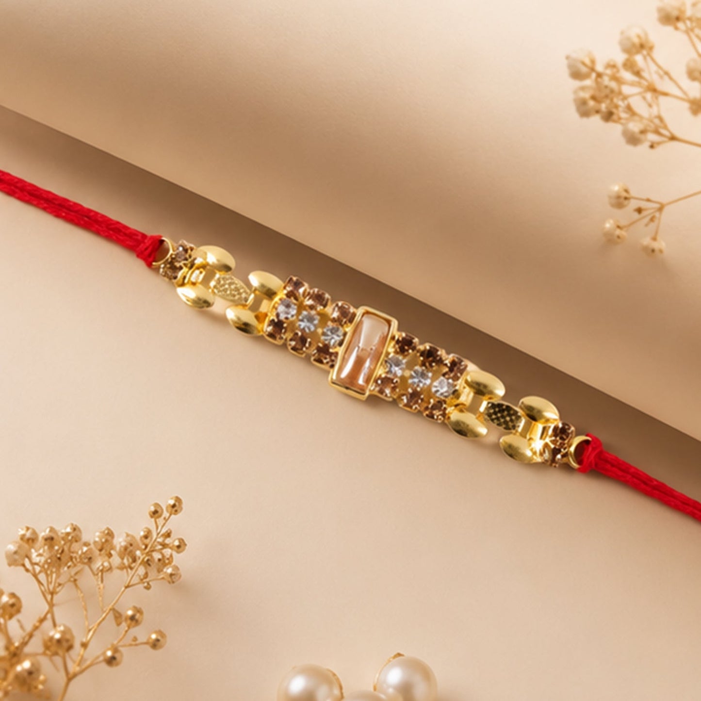 Side view of the designer AD Stone Rakhi with sparkling artificial diamonds.