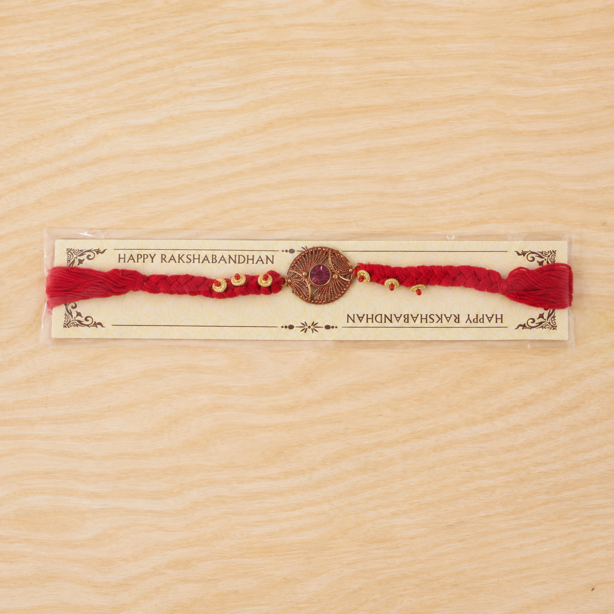 Back view showing neat woven thread finish on the handcrafted Rakhi.