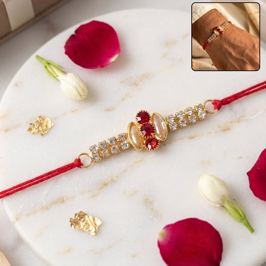 Elegant gold Rakhi with pink stone & AD studded design for brothers