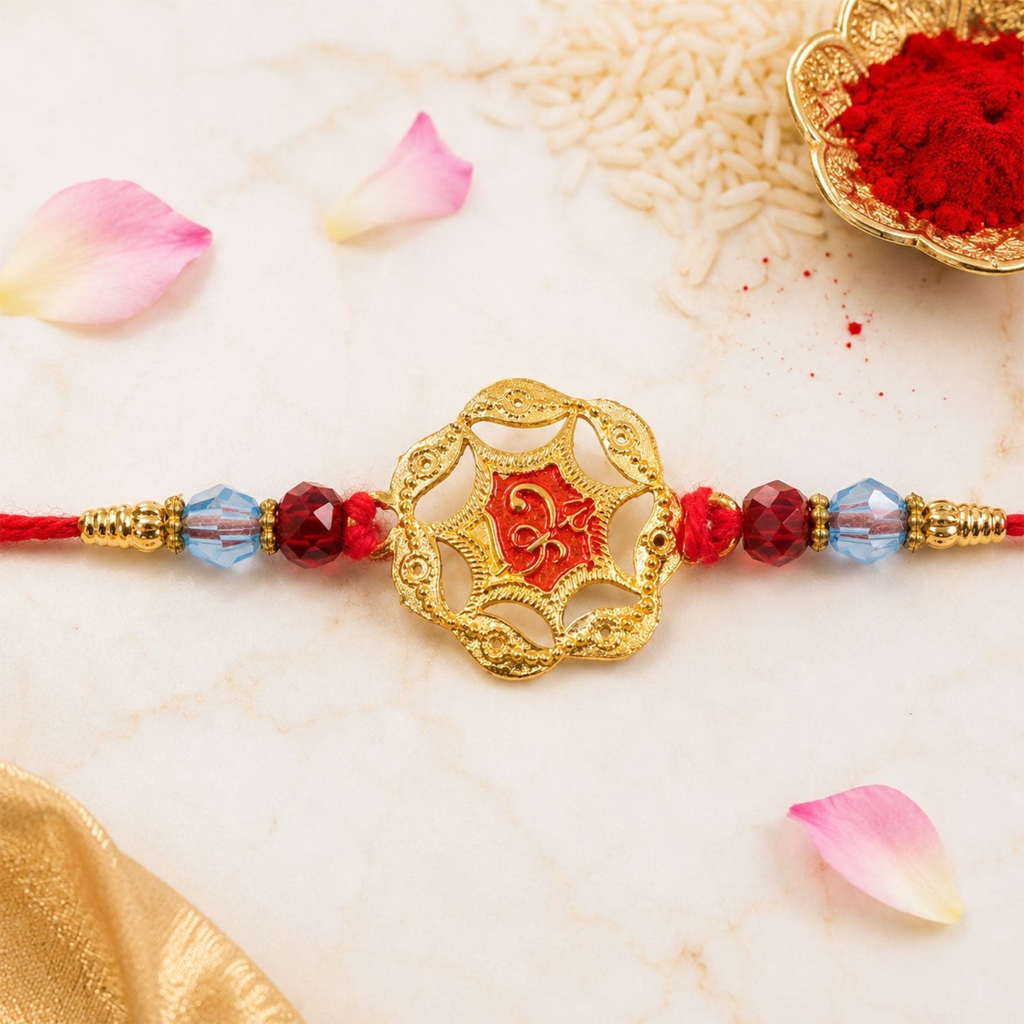 Detailed shot of crystal beads and red stones embedded in golden floral pattern.