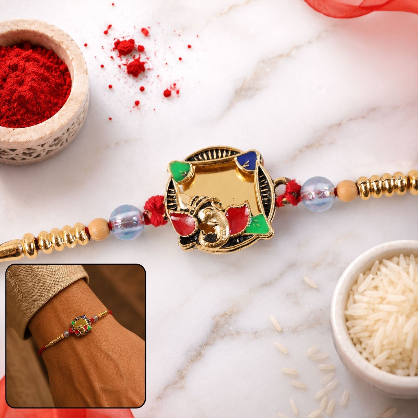 Golden elephant Rakhi with colourful stones for brother.