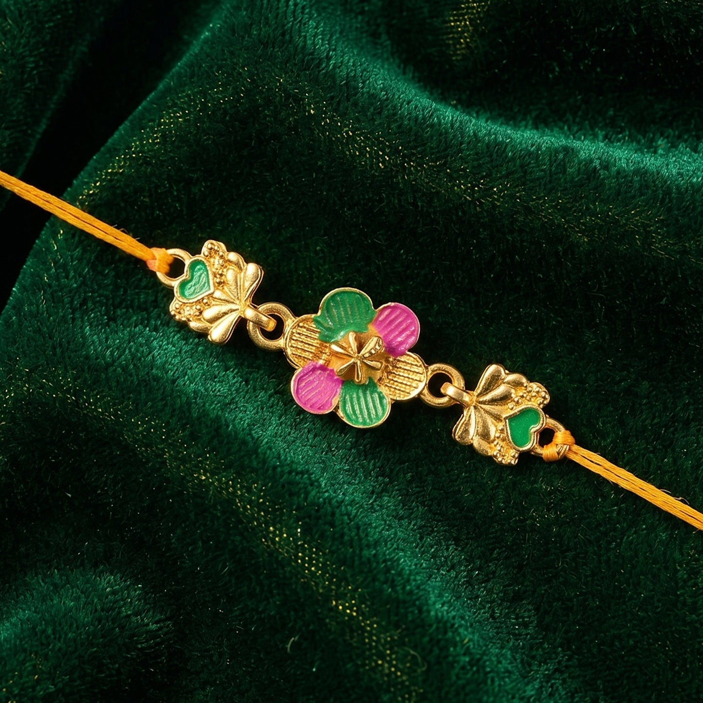Front view of the designer Golden Meenakari Rakhi for brother.