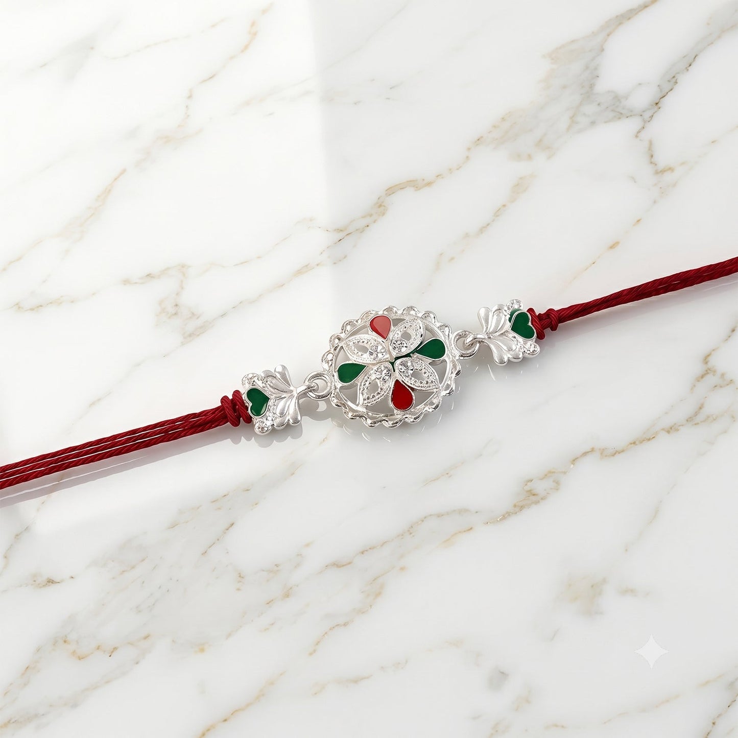 Side view highlighting the floral pattern and oxidised finish of the Rakhi.