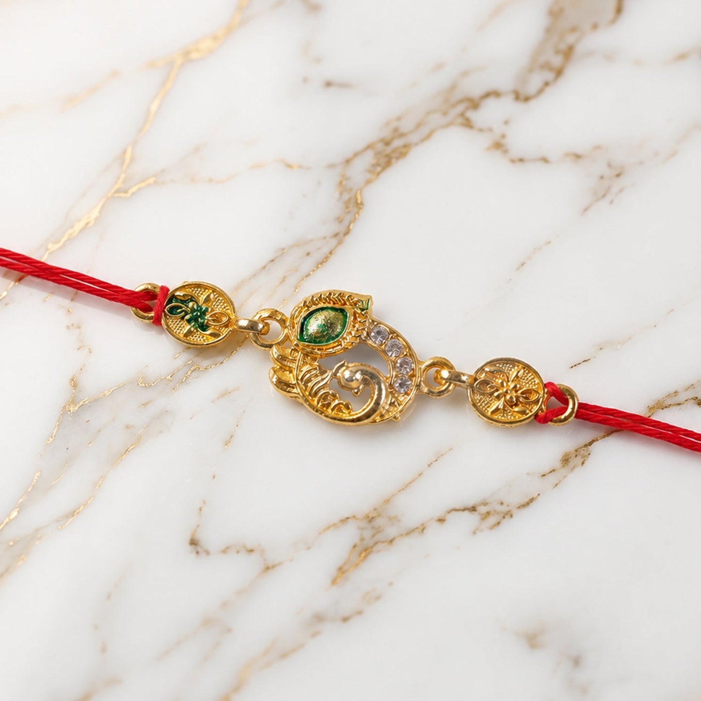 Close-up of the AD stone and vibrant Meenakari work on the designer rakhi.