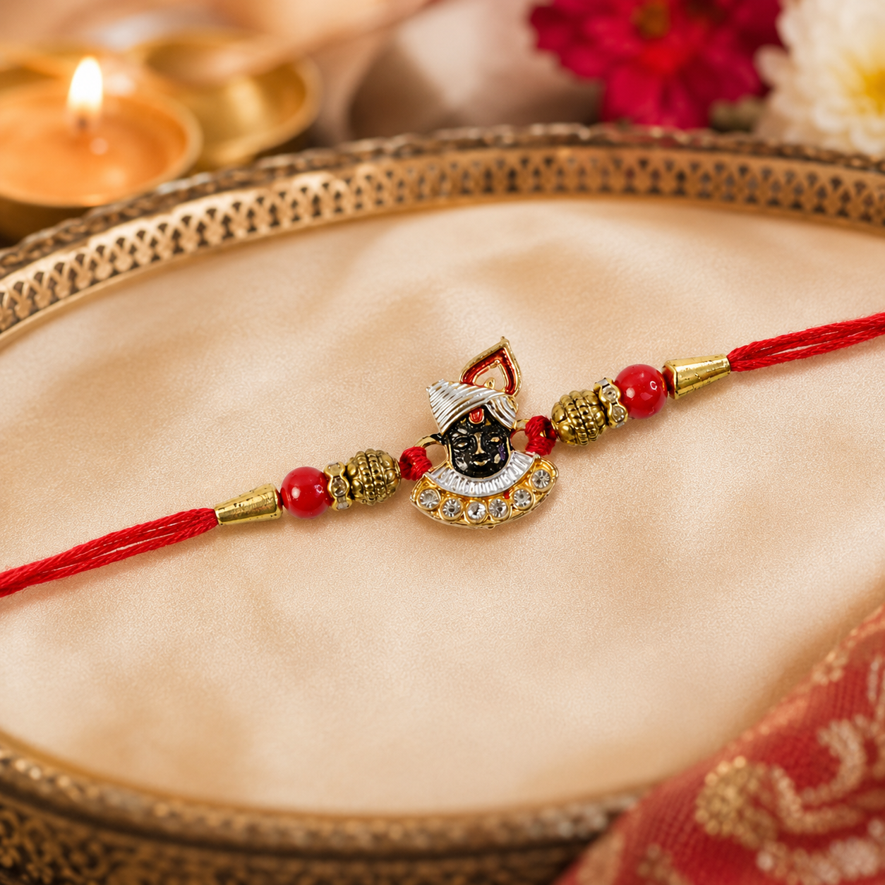 Top view of the elegant AD stones Rakhi with vibrant red beads.