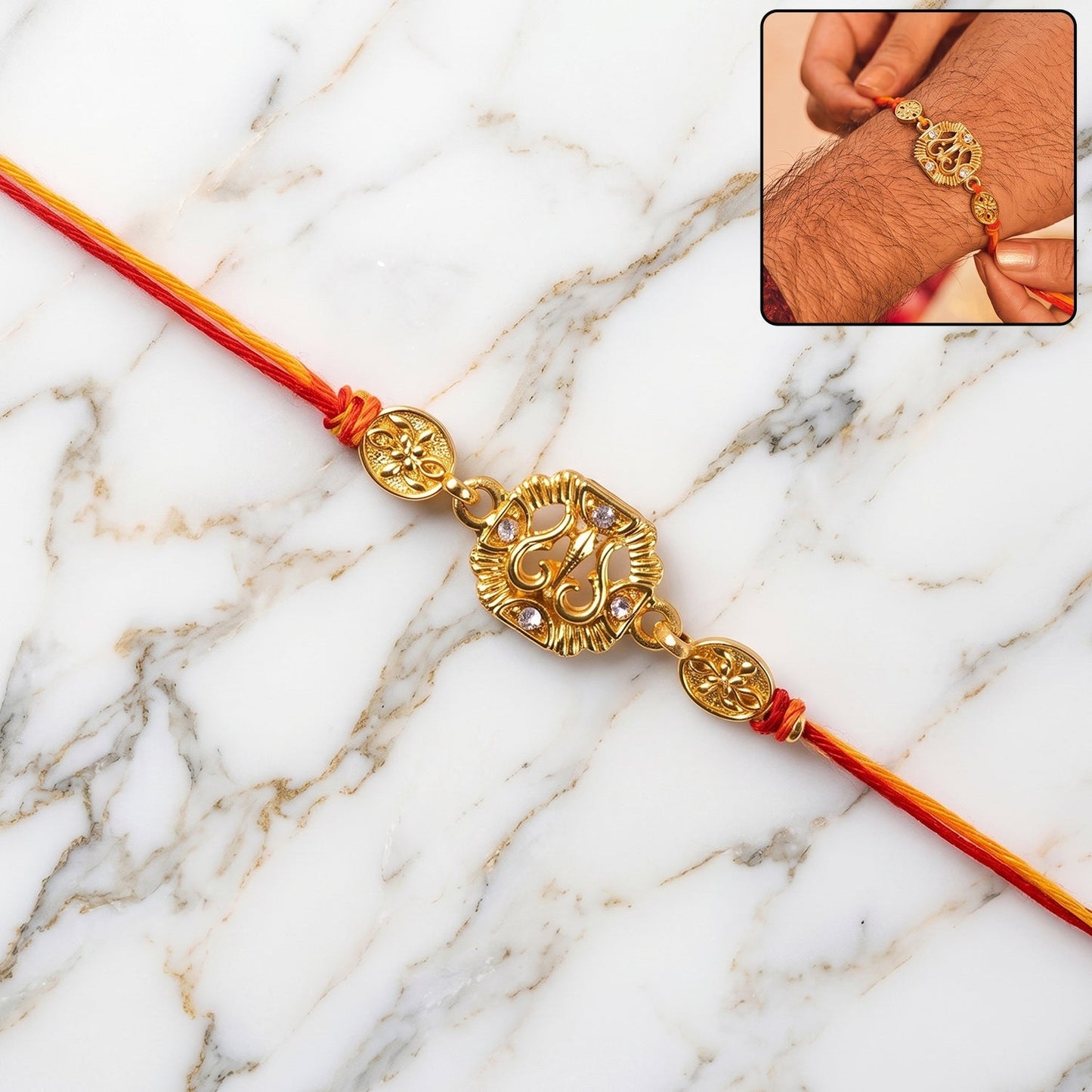 Close-up of a Traditional Rakhi featuring a golden Om symbol and intricate leaf design.