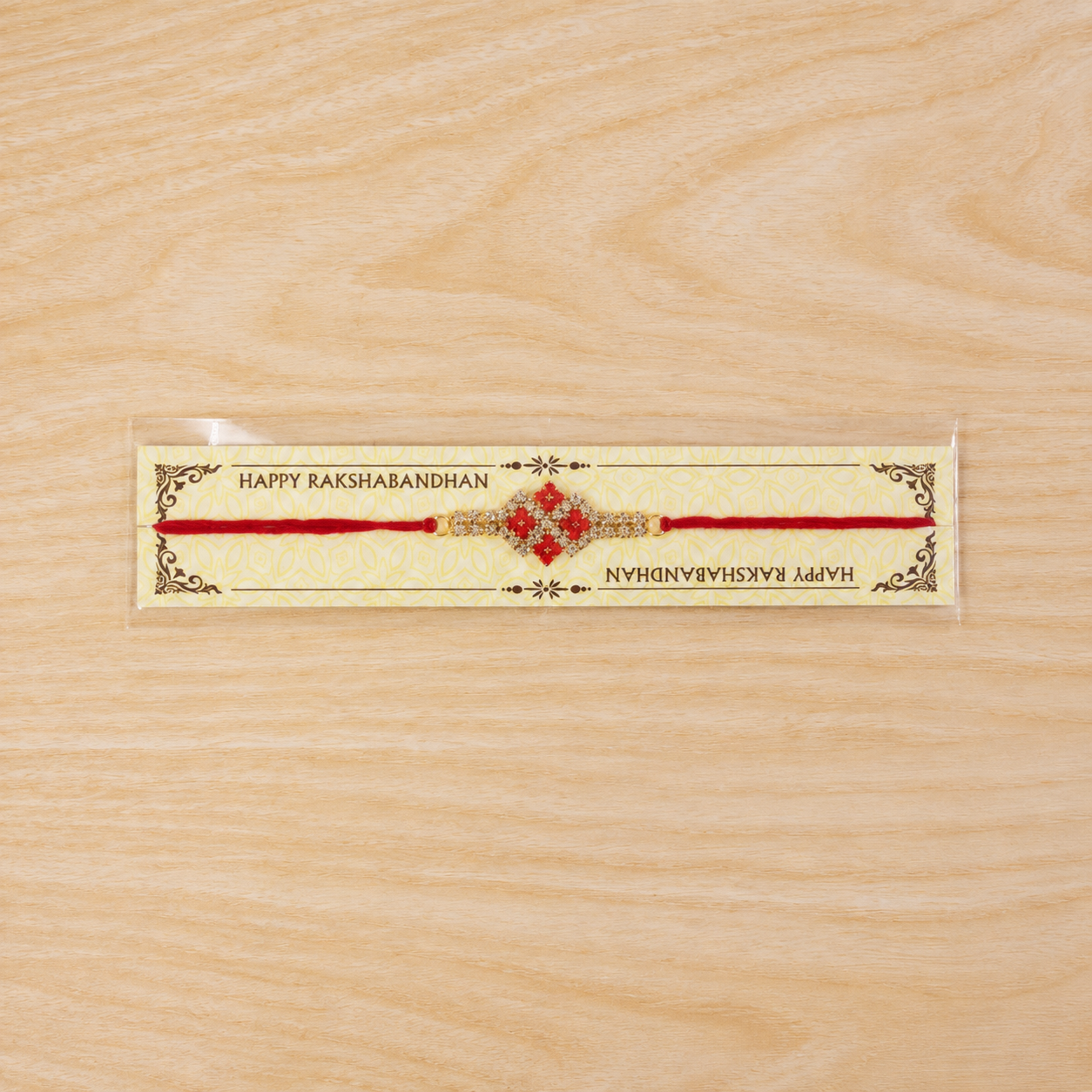Detail shot of red stones and AD work on the rakhi.