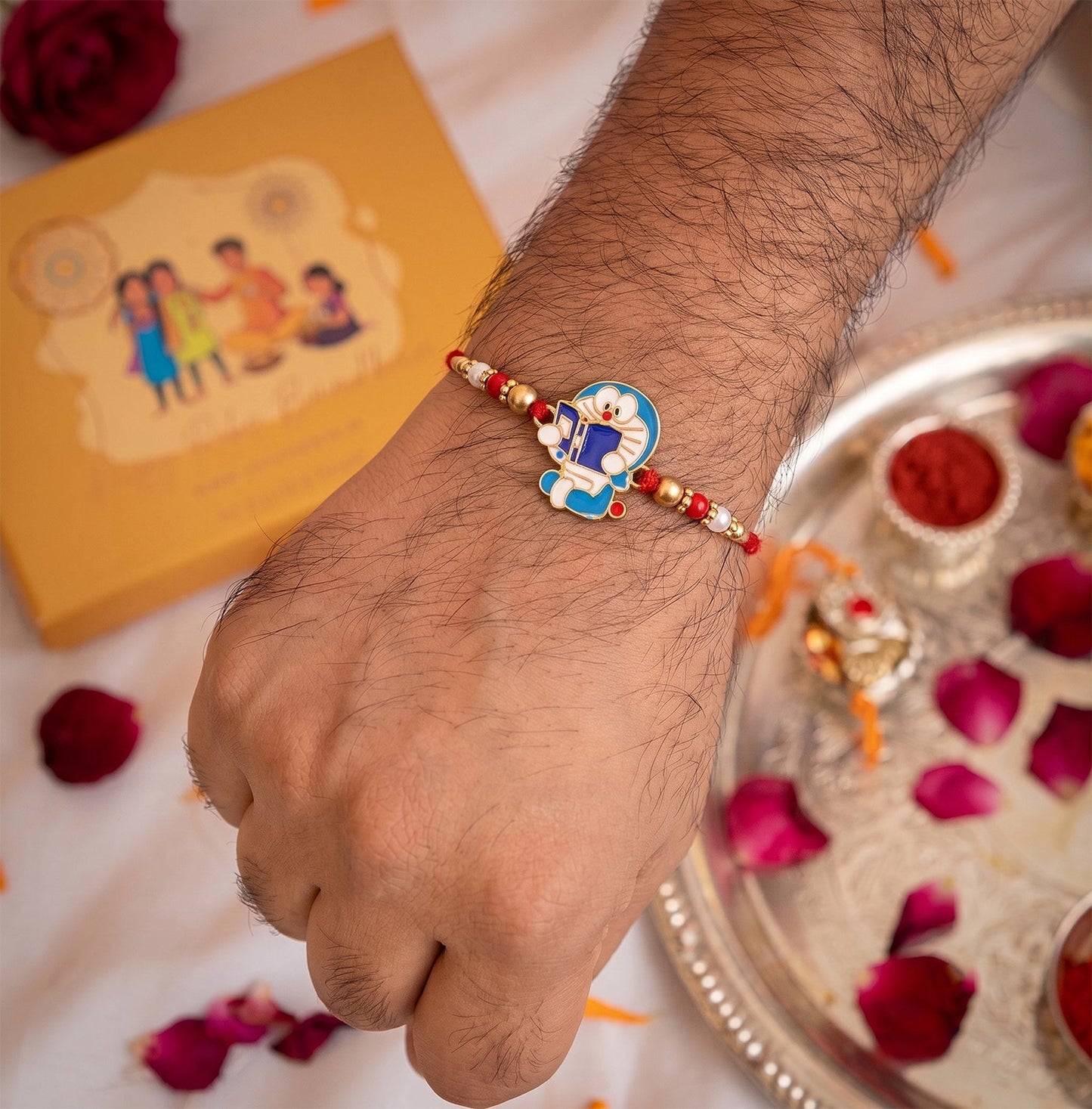 Close-up of Doraemon cartoon motif on the festive rakhi.