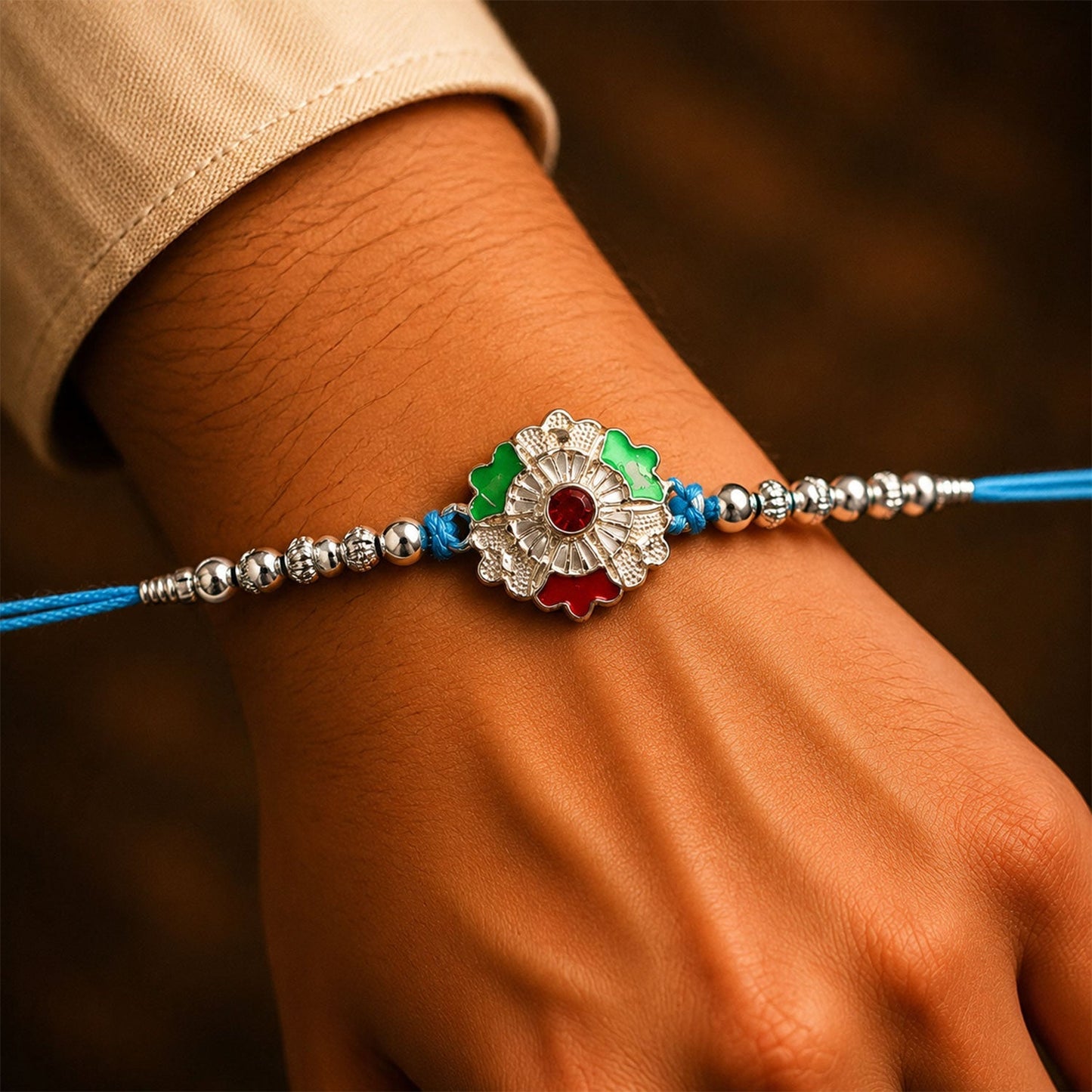 Decorative silver meenakari floral Rakhi with beads for Raksha Bandhan