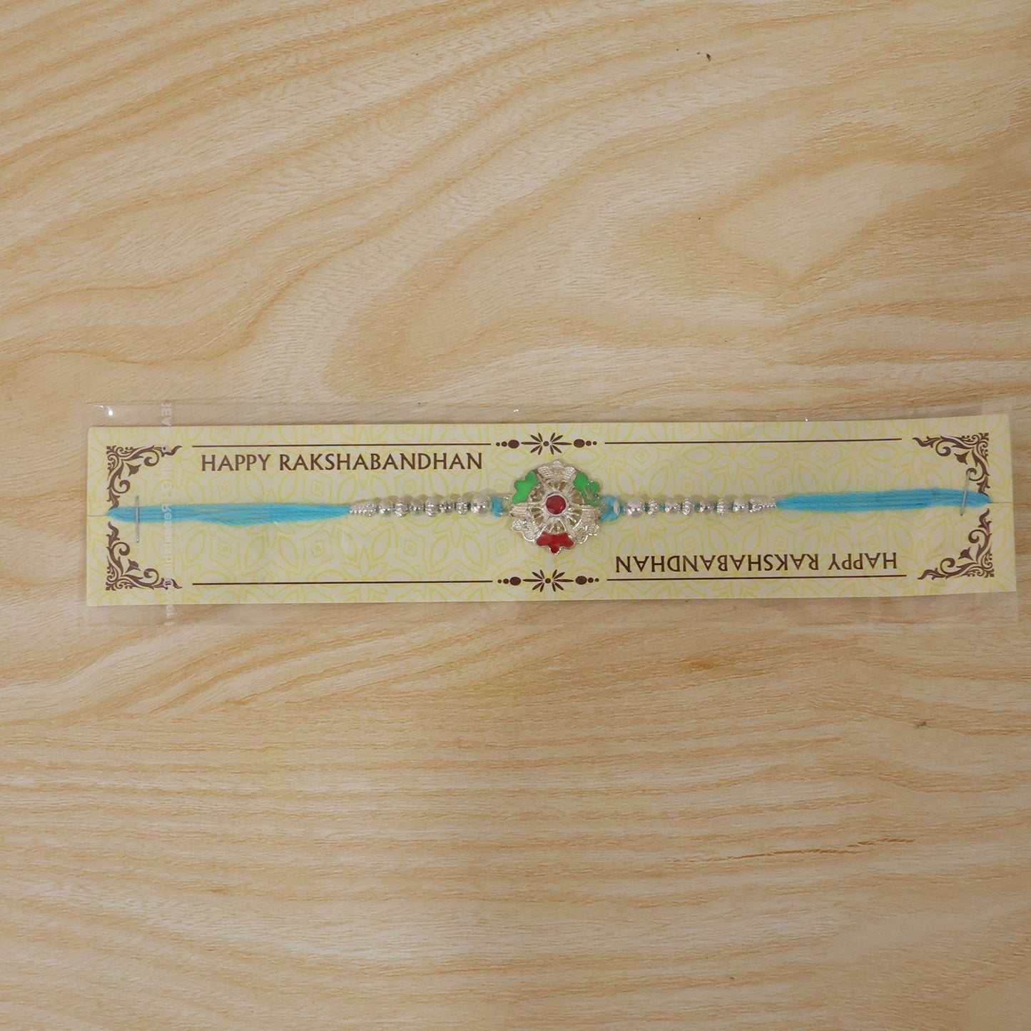 Beautiful traditional silver meenakari floral Rakhi with beads for Rakshabandhan