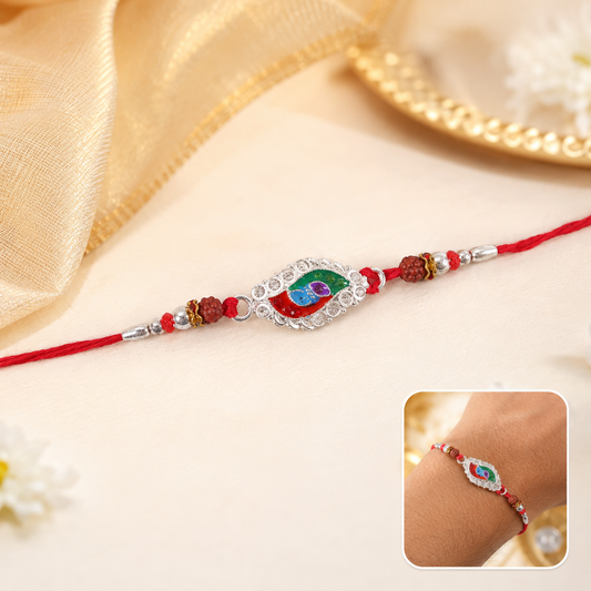 Close-up of silver meenakari marquise beads rakhi with intricate design
