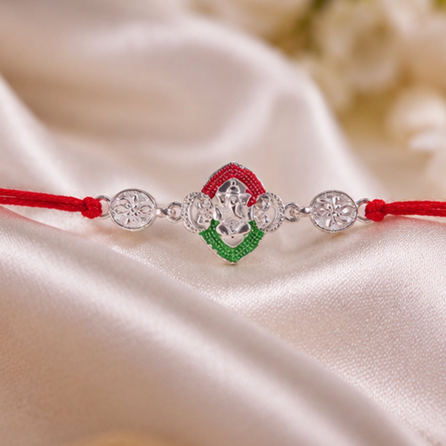 Silver Ganesha Meenakari Rakhi showcasing fine craftsmanship.