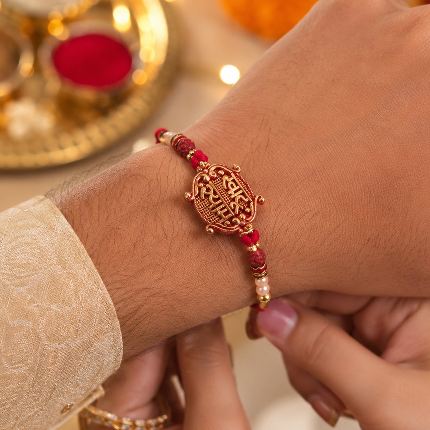 Side view of the antique maroon Meenakari Rakhi with Rudraksha beads, showing comfort.