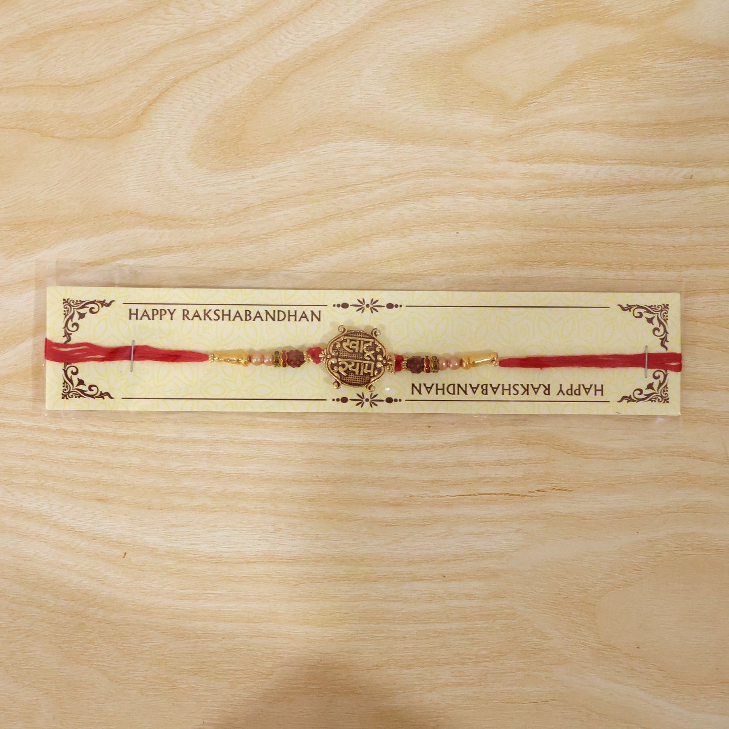 Beautifully displayed Meenakari Rakhi on festive background.