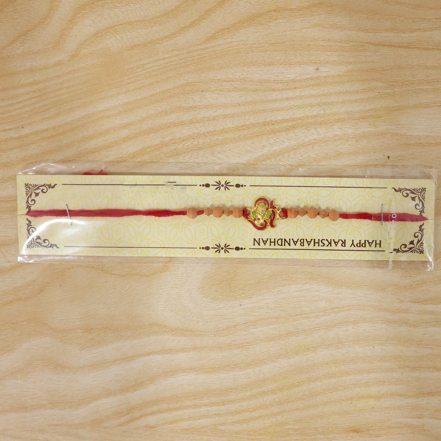 Vibrant Lord Ganesha Rakhi with intricate craftsmanship.