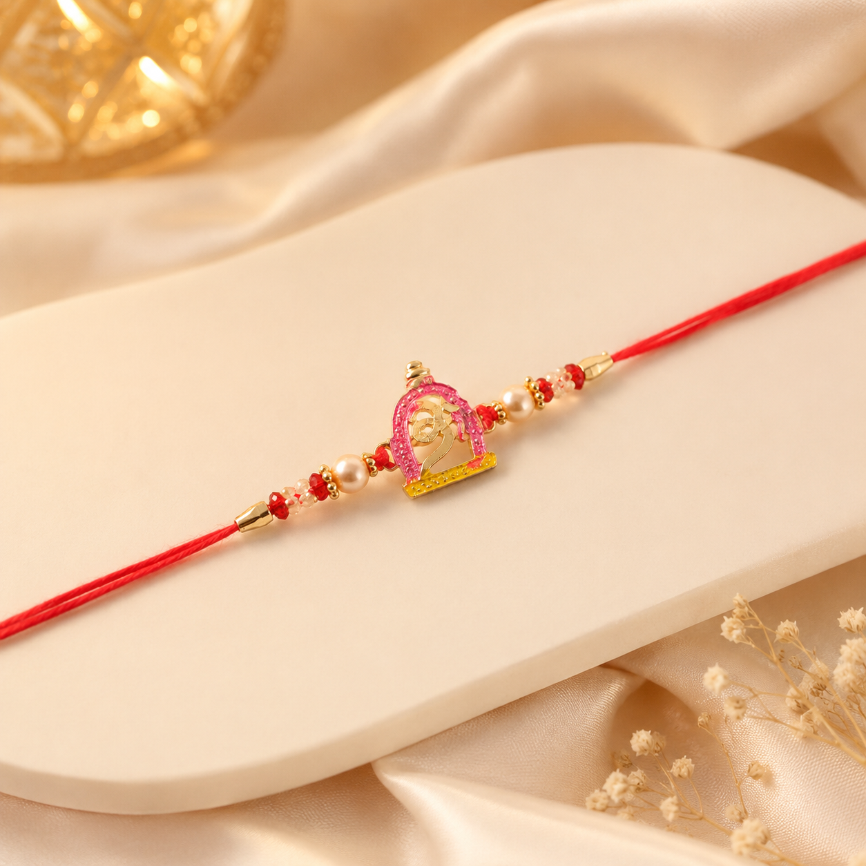 Festive pink meenakari rakhi with traditional and contemporary elements for Raksha Bandhan