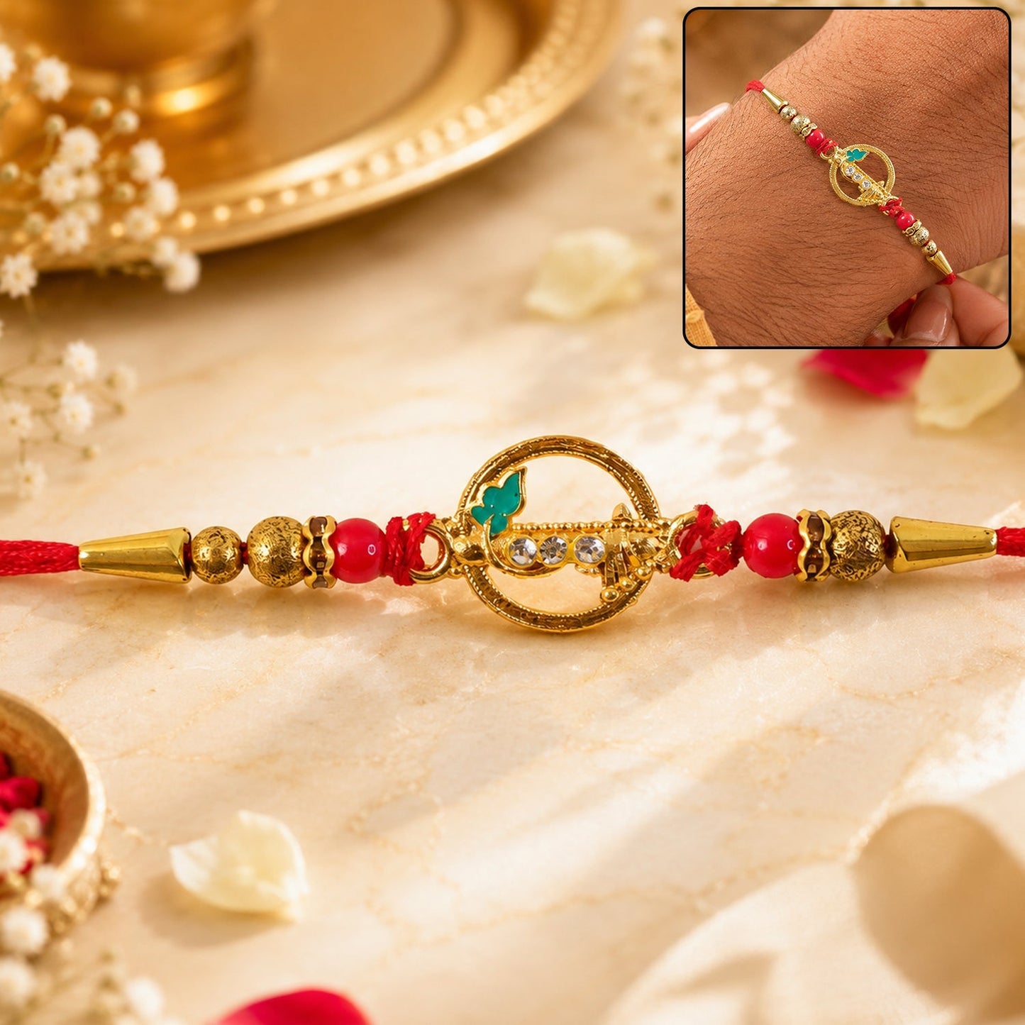 Golden peacock design rakhi with kundan and red beads, festive accessory