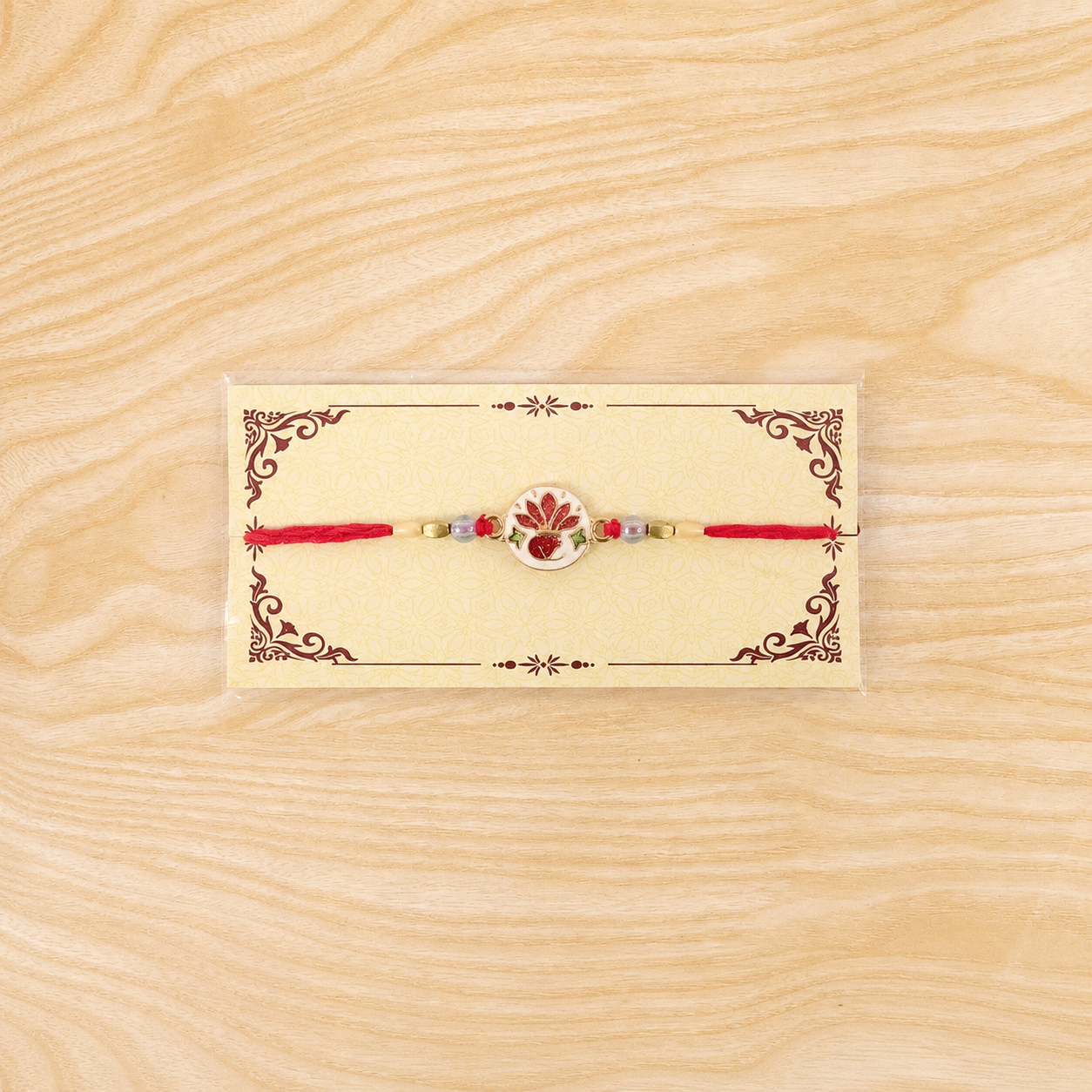 Stylish traditional ceramic floral rakhi with beads and elegant finishing.