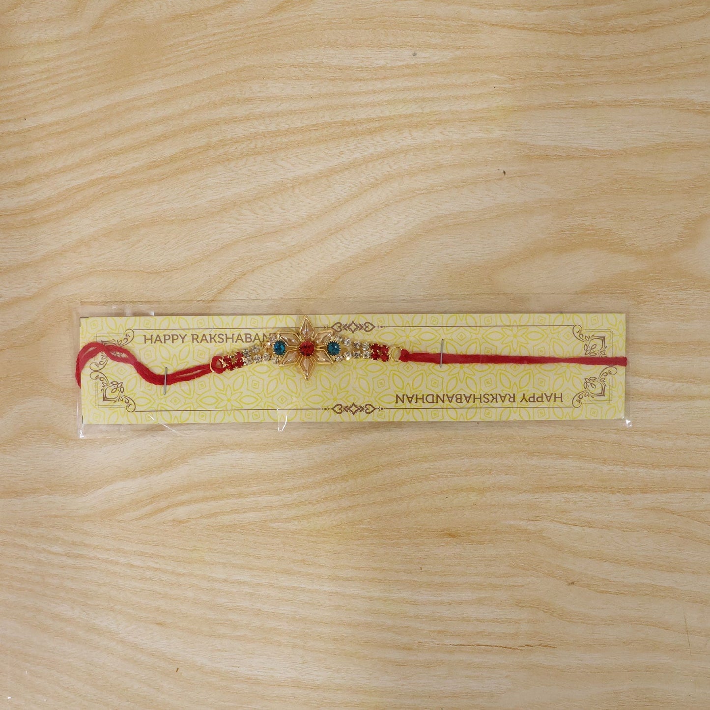 The festive rakhi with intricate kundan design and colorful beads