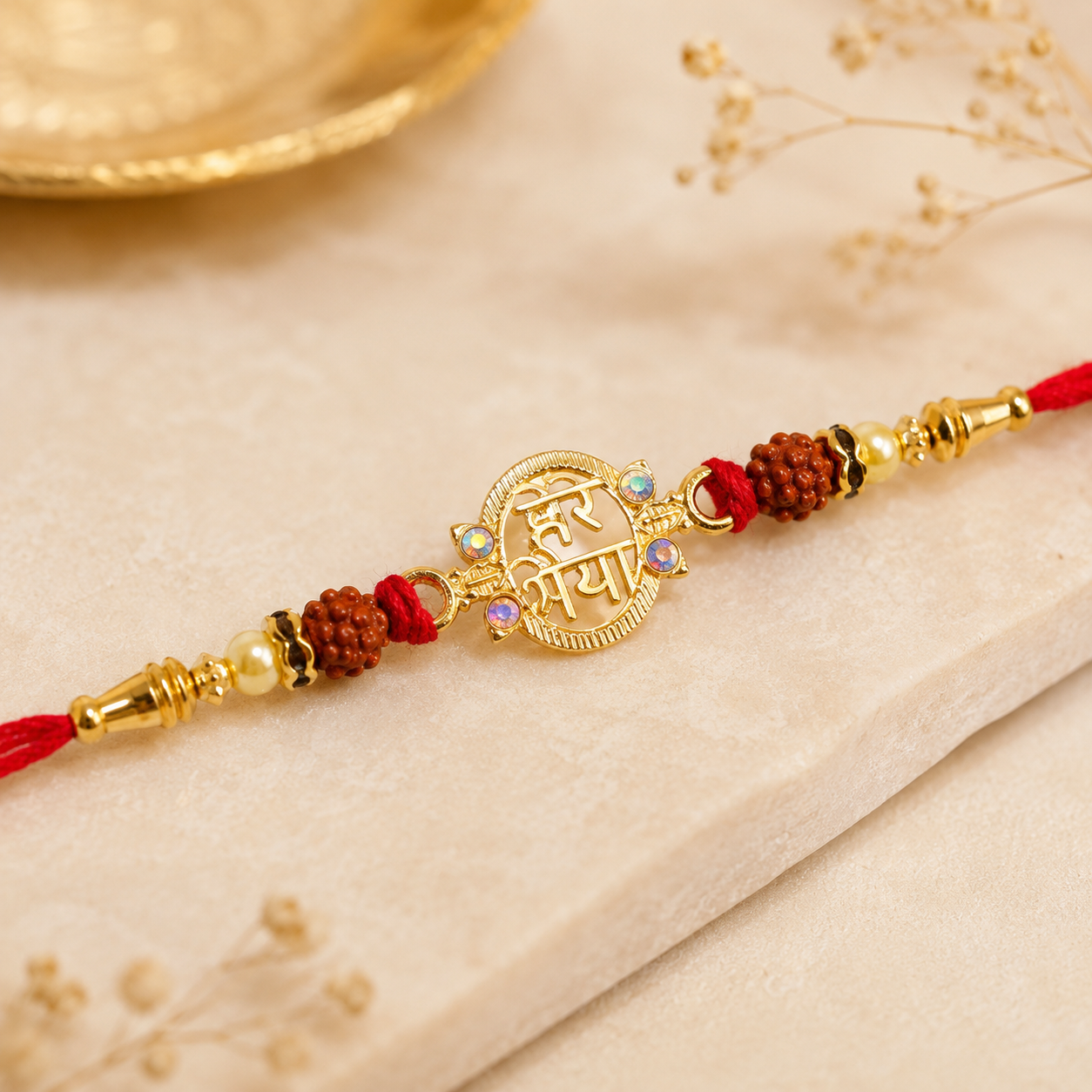 Beautiful Rudraksha Rakhi with golden Shiv Mantra centerpiece, ideal for Raksha Bandhan commemorations.
