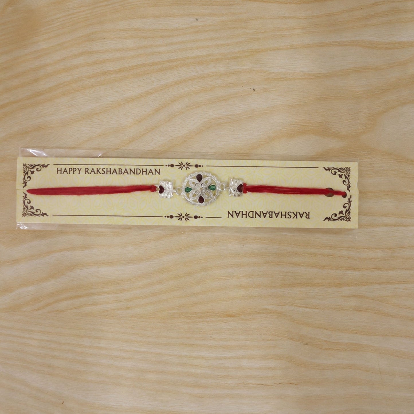 Stylish Silver Floral Rakhi on display for Raksha Bandhan