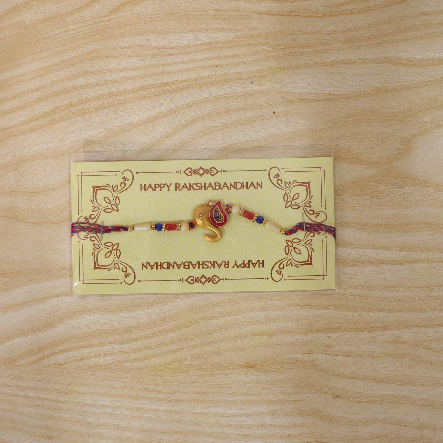 Festive Rakhi with detailed beadwork and gold accents for brothers