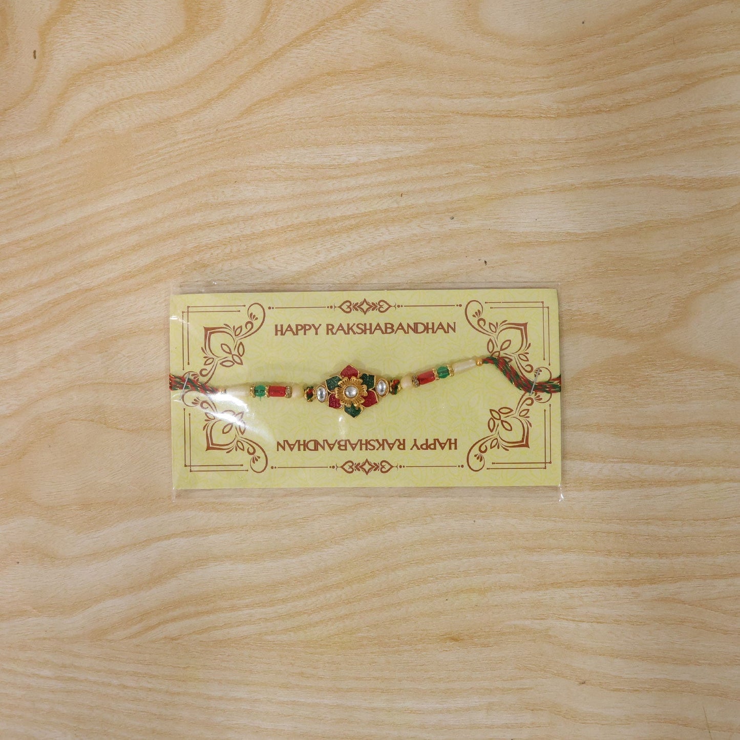 Traditional festive Rakhi with elegant meenakari and kundan design