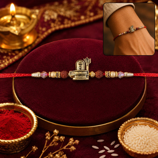 Antique gold Shivling and Trishul Rakhi with traditional craftsmanship