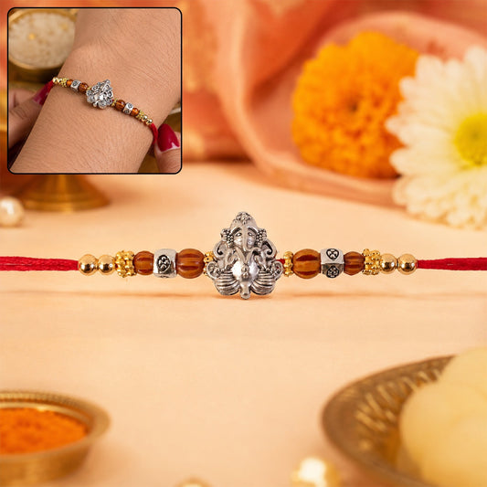 Elegant Silver Lord Ganesha Rakhi with Rudraksha beads for Raksha Bandhan